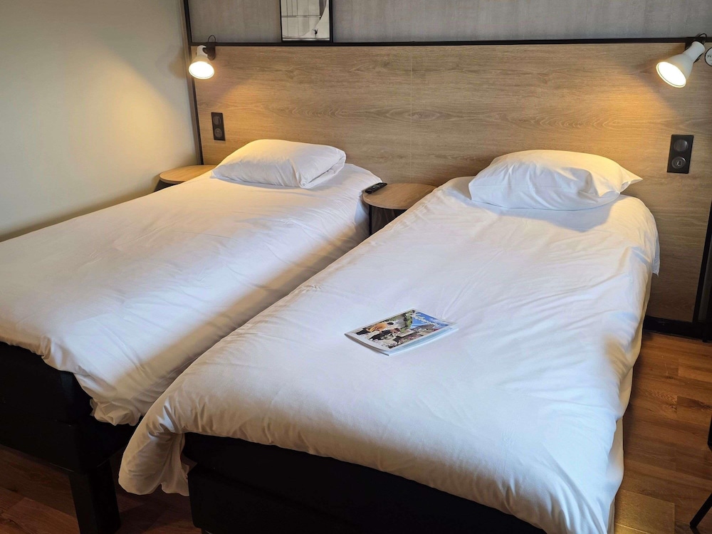 Habitación estándar con 2 camas individuales del hotel Ibis Chateauroux. Foto 7