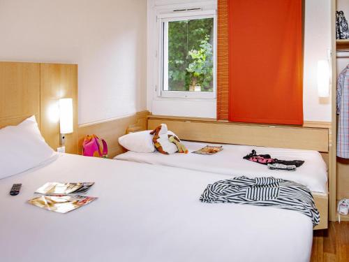 Habitación Doble con Cama supletoria del hotel Ibis Mulhouse Centre Filature