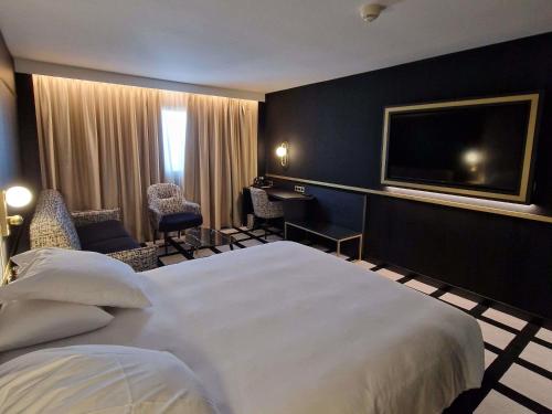 Suite Junior con una cama King del hotel Mercure Orléans Centre. Foto 1