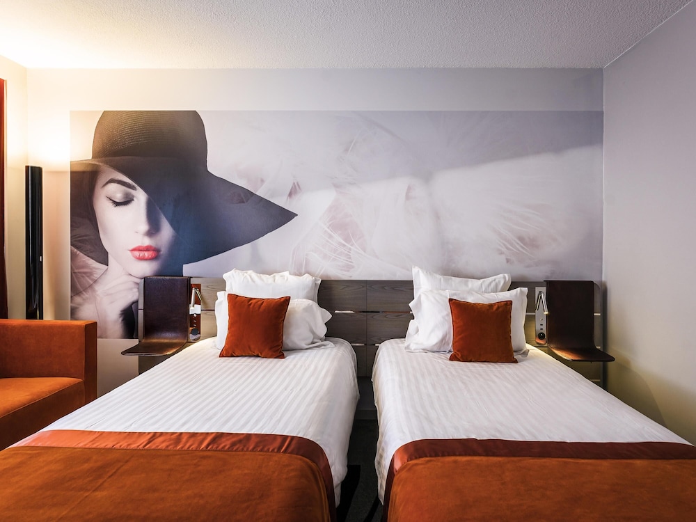 Habitación Clásica con camas individuales del hotel Novotel Orleans St Jean Braye. Foto 3