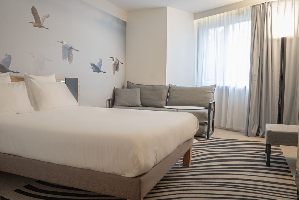 Habitación Familiar N'Room con cama doble y sofá - cama individual de 2,6 pies cada cama del hotel Novotel Valence Sud