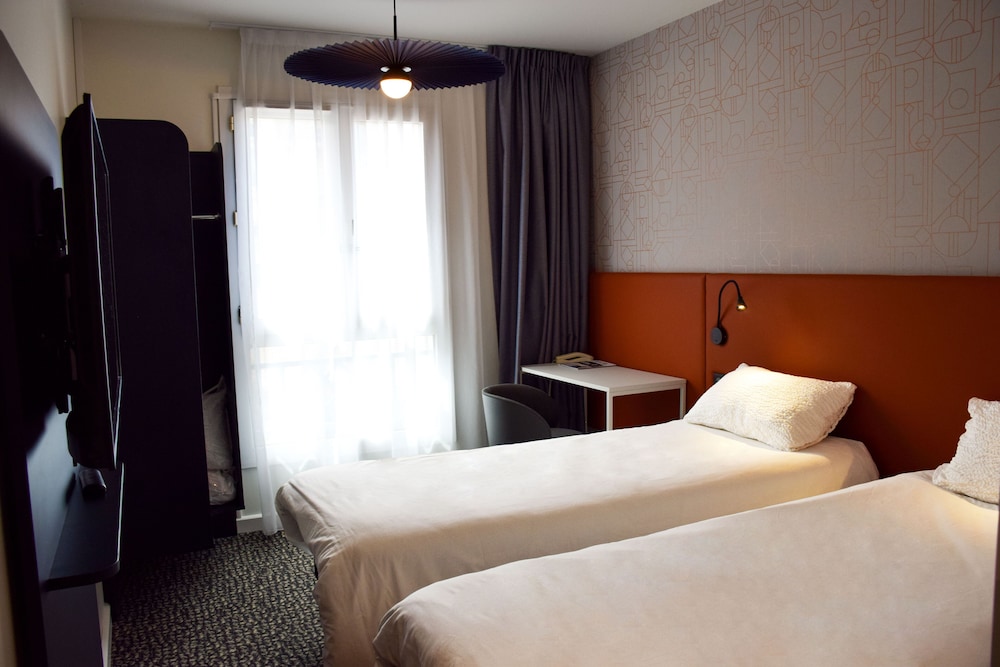 Habitación estándar con dos camas individuales del hotel Ibis Rodez Centre Cathedrale. Foto 5