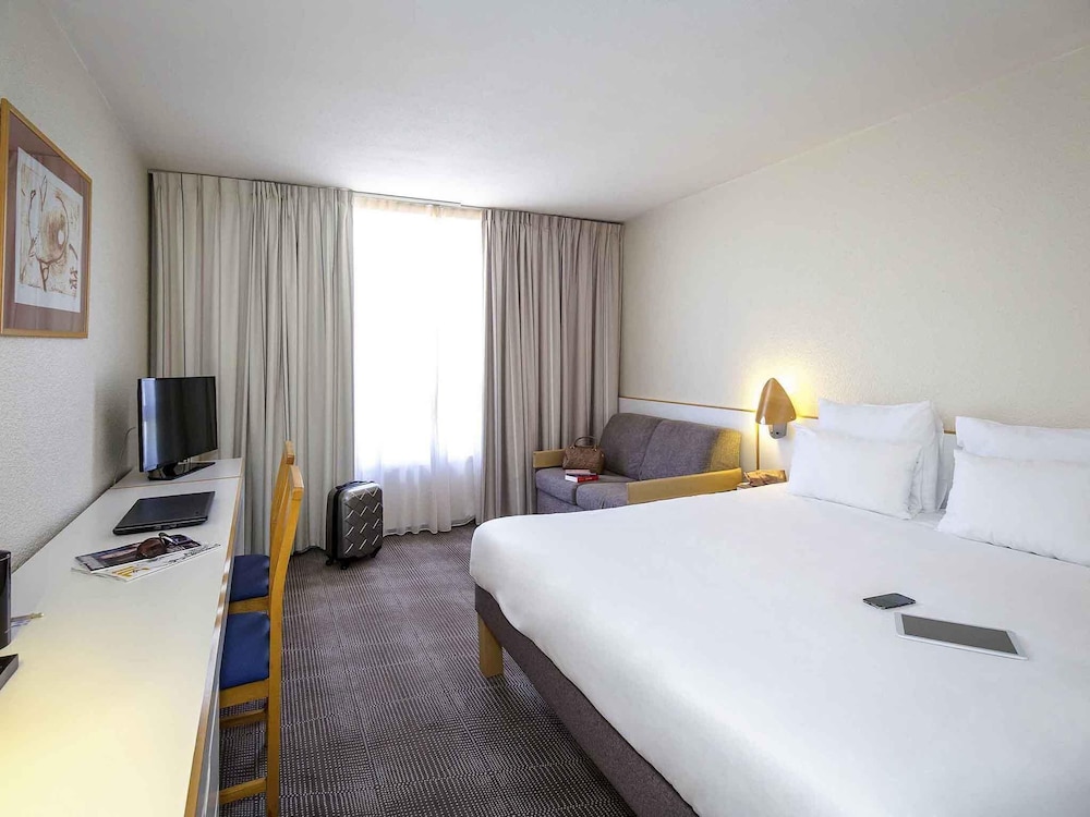 Habitación Clásica - 1 cama doble y 1 sofá - cama para 1 persona del hotel Novotel Perpignan Nord Rivesaltes. Foto 9