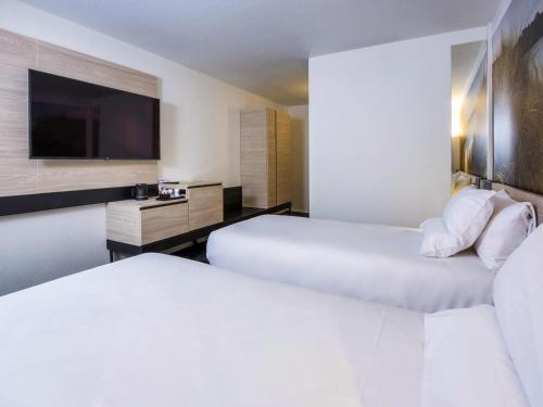 Habitación Clásica con 1 cama individual del hotel Novotel Rennes Alma. Foto 6