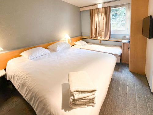 Habitación Estándar - 1 cama doble y 1 individual del hotel IBIS RENNES CESSON. Foto 3