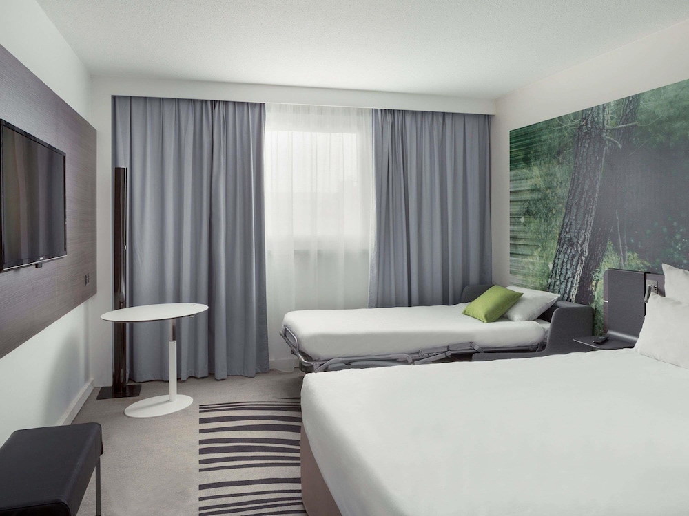 Habitación ejecutiva, 1 cama doble con sofá cama del hotel Novotel Paris Charles de Gaulle Airport. Foto 4