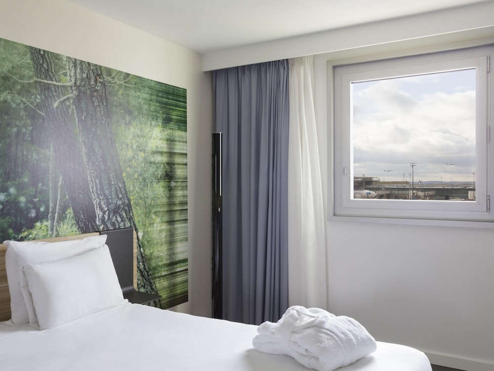 Habitación doble Business Sofá Cama incluido 1 Cama doble Normal del hotel Novotel Paris Charles de Gaulle Airport
