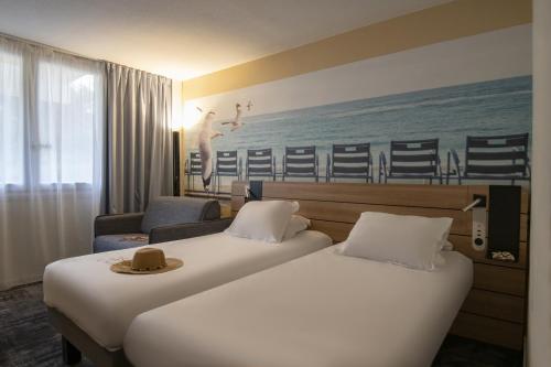 Habitación Clásica con 1 cama doble y 1 sofá - cama doble del hotel Novotel Antibes Sophia Antipolis. Foto 11