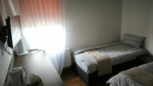 Habitación Familiar Deluxe del hotel OYO The Kilburn Arms. Foto 3