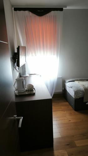 Habitación Familiar Deluxe del hotel OYO The Kilburn Arms. Foto 8