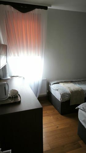 Habitación Familiar Deluxe del hotel OYO The Kilburn Arms. Foto 10