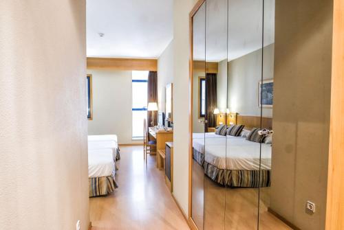 Habitación Triple del hotel Alda Castelao. Foto 2