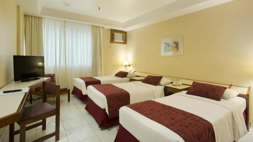 Habitación Triple Estándar del hotel Atlantico Copacabana. Foto 1