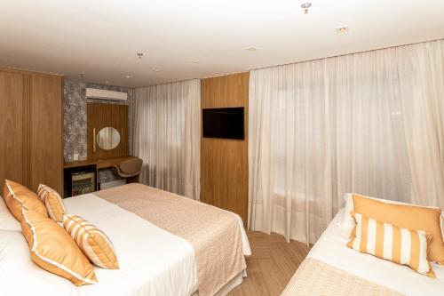 Habitación Triple de lujo del hotel Astoria Ipanema. Foto 1
