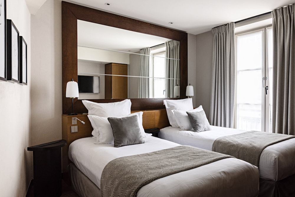 Habitación estándar, 2 camas individuales del hotel Holiday Inn Paris Palais De L'elyse, An Ihg Hotel. Foto 1