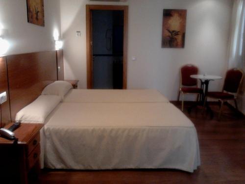 Habitación Doble con cama supletoria - 2 camas del hotel Eurico. Foto 1