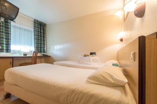 Habitación Doble - 2 camas del hotel Campanile Lisbon South - Setubal. Foto 6