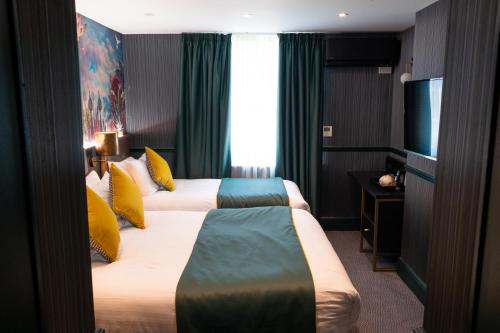 Habitación Triple Deluxe del hotel Hyde Park Green. Foto 17