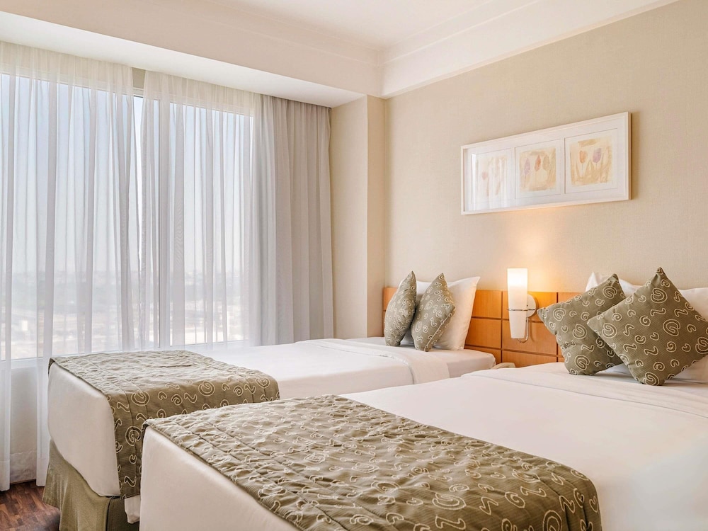 Habitación superior con 2 camas individuales del hotel Mercure Guarulhos Aeroporto. Foto 7