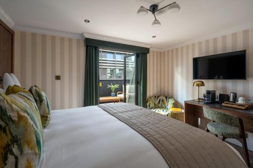 Habitación Doble Deluxe con terraza en la azotea del hotel The Chamberlain. Foto 8