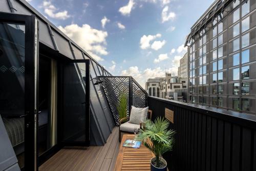 Habitación Doble Deluxe con terraza en la azotea del hotel The Chamberlain. Foto 12