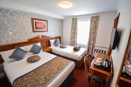 Habitación Triple del hotel Pembridge Palace