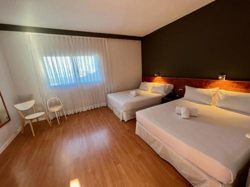 Habitación Familiar Cuádruple - 2 camas del hotel AP Madrid Airport. Foto 6