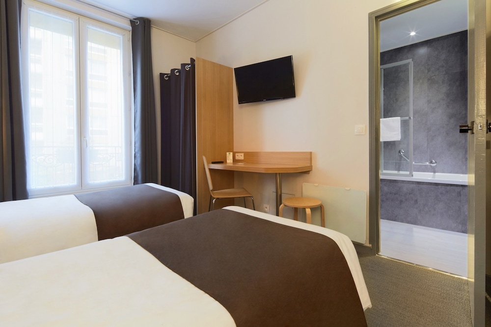 Habitación con 2 camas individuales del hotel HOTEL PARIS VILLETTE. Foto 1