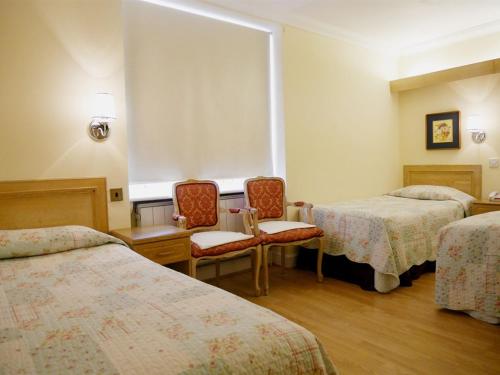 Habitación Cuádruple Estándar del hotel Gresham
