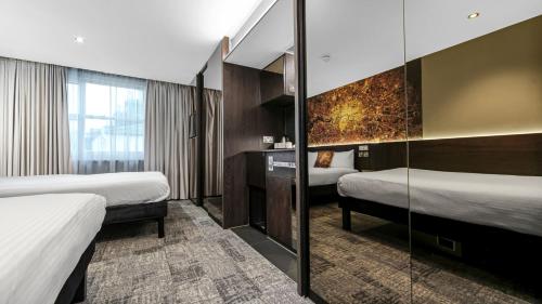 Habitación Doble - 2 camas dobles del hotel Heeton Concept - Luma Hammersmith. Foto 8