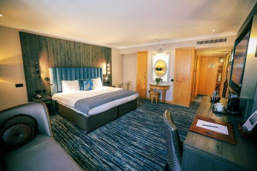 Habitación Deluxe con cama extragrande del hotel Courthouse Hotel London
