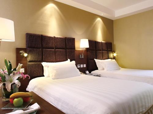 Habitación Doble Deluxe - 2 camas del hotel Beijing Peace. Foto 1