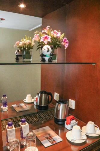 Deluxe King with Sofa Bed del hotel Beijing Peace. Foto 1