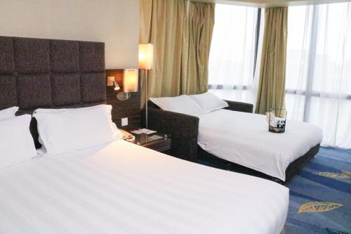 Deluxe King with Sofa Bed del hotel Beijing Peace. Foto 4
