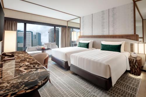 Habitación Deluxe con vistas a la ciudad del hotel Pan Pacific Singapore. Foto 4
