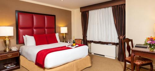 Habitación Deluxe del hotel Fitzpatrick Grand Central. Foto 1