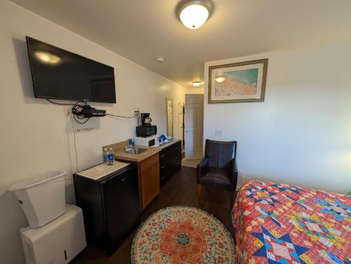 Habitación con cama extragrande - Adaptada para personas de movilidad reducida del hotel Apple Inn and Suites Cooperstown Area. Foto 1