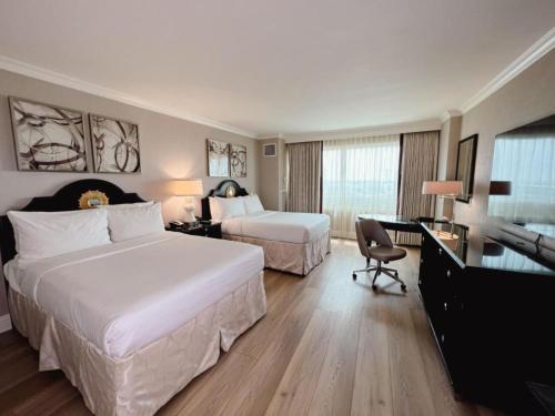 Habitación Deluxe con 2 camas dobles del hotel The Commerce Casino and. Foto 3