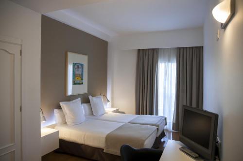 Habitación Confort con vistas - 1 o 2 camas del hotel Alcazar. Foto 8