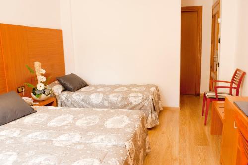 Habitación Doble con cama supletoria del hotel Ramblas Barcelona. Foto 2