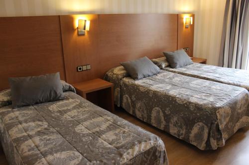 Habitación Doble con cama supletoria del hotel Ramblas Barcelona. Foto 9