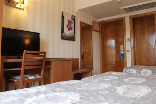 Habitación Doble con cama supletoria del hotel Ramblas Barcelona. Foto 10