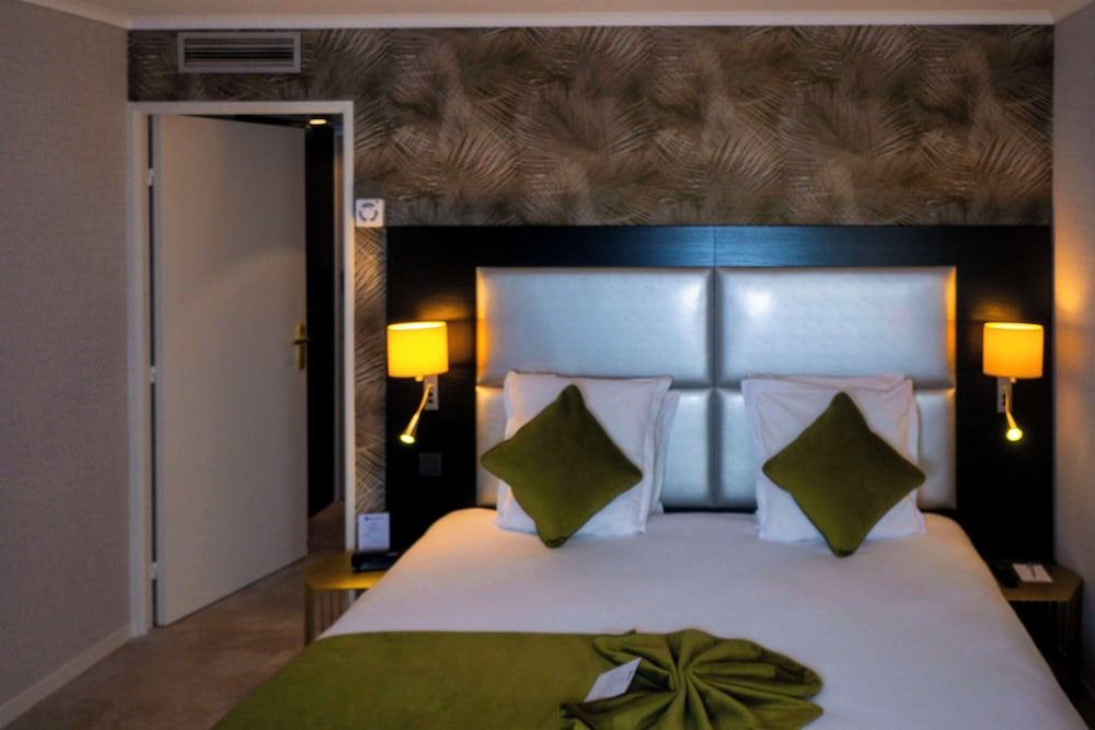 Habitación clásica, varias camas del hotel Best Western Allegro Nation
