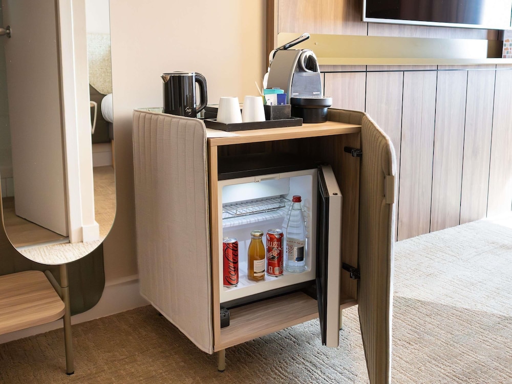 Habitación Executive - Una cama doble y sofá cama individual del hotel Novotel Toulouse Purpan Aéroport. Foto 5