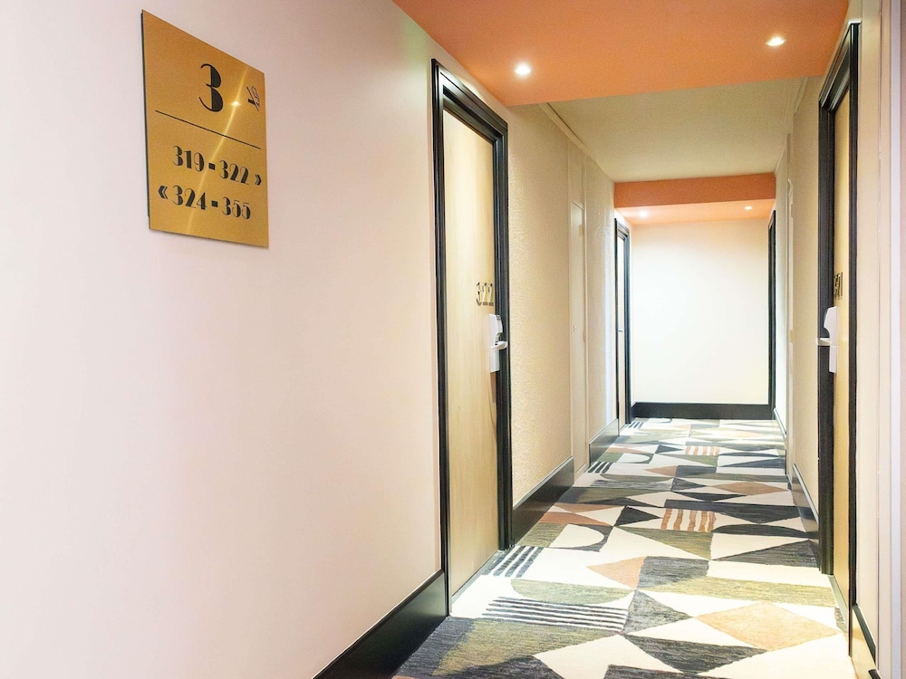 Habitación Executive - Una cama doble y sofá cama individual del hotel Novotel Toulouse Purpan Aéroport. Foto 6