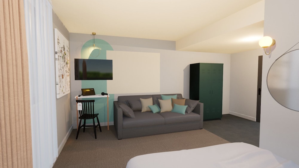 Habitación Pop Plus con 1 cama doble y 1 sofá modular del hotel Greet Brest Aéroport. Foto 1