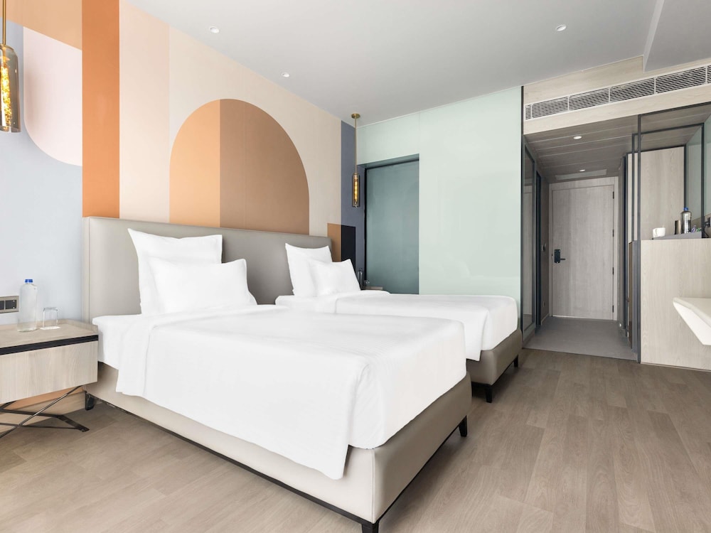 Habitación Clásica con 2 camas individuales y sofá del hotel Mercure Chandigarh Tribune Chowk