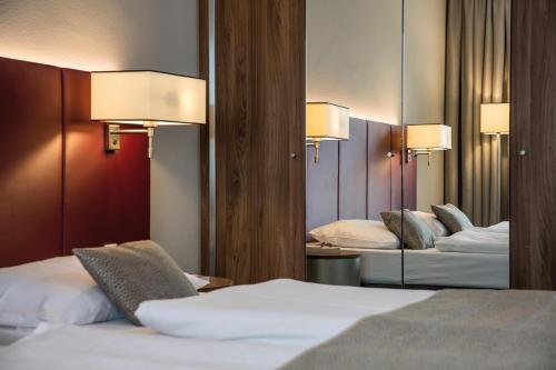 Habitación Superior del hotel Austria Trend Europa Salzburg. Foto 5
