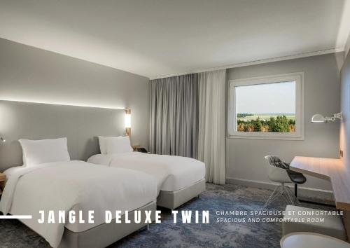 Habitación Doble Deluxe - 2 camas - Servicio de enlace con el aeropuerto gratuito del hotel The Jangle Hotel - Paris - Charles de Gaulle - Airport