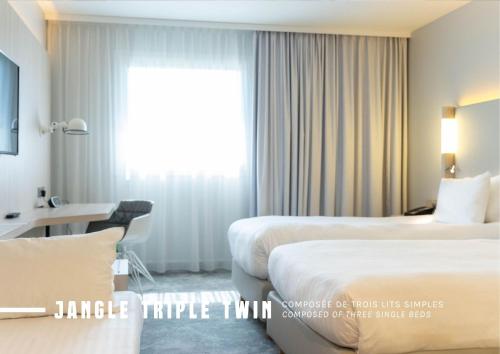 Comfort Triple Room - Free Airport Shuttle del hotel The Jangle Hotel - Paris - Charles de Gaulle - Airport. Foto 1